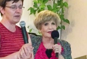 Suellen speaking in Poland with an Interpreter.
